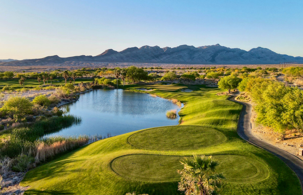 Panoramic view of Coyote Springs Golf Club with desert valley and mountain ranges